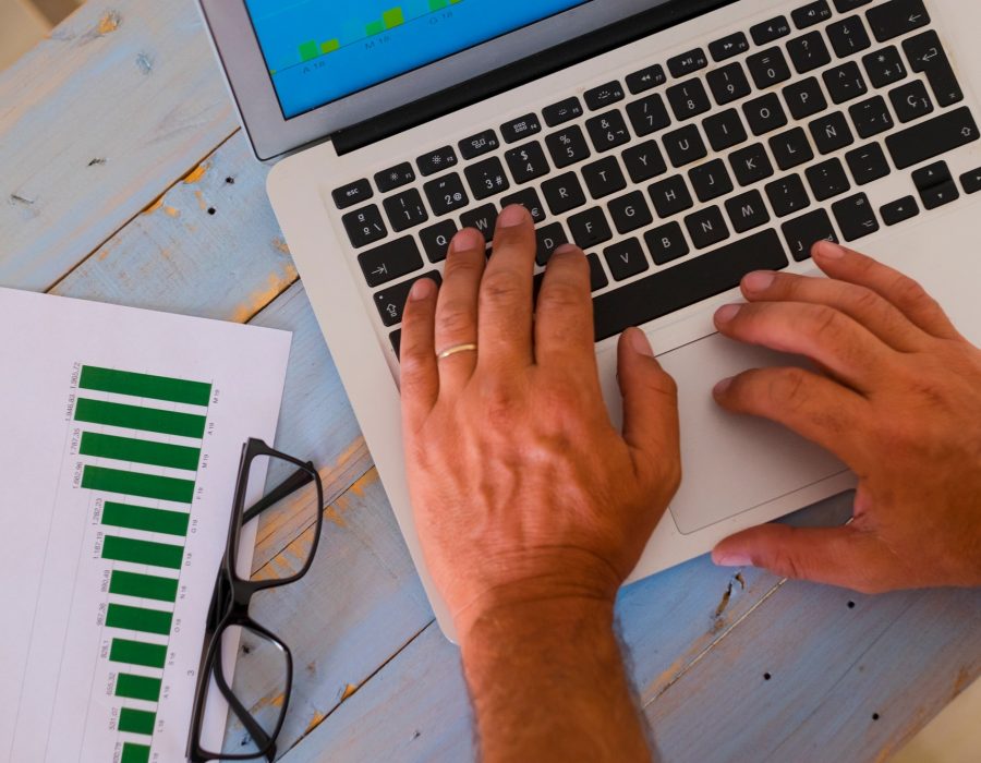 close up of hands of man on a laptop working hard to create an agency - business man